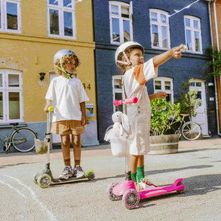 A child wearing a helmet and protective pads