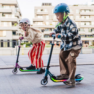 A six-year-old child riding a scooter